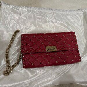 Red and gold Valentino with chain strap crossbody